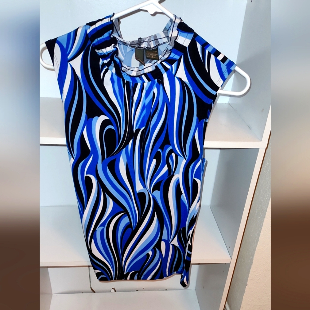 Beautiful blue turtle neck sleeveless dress shirt.